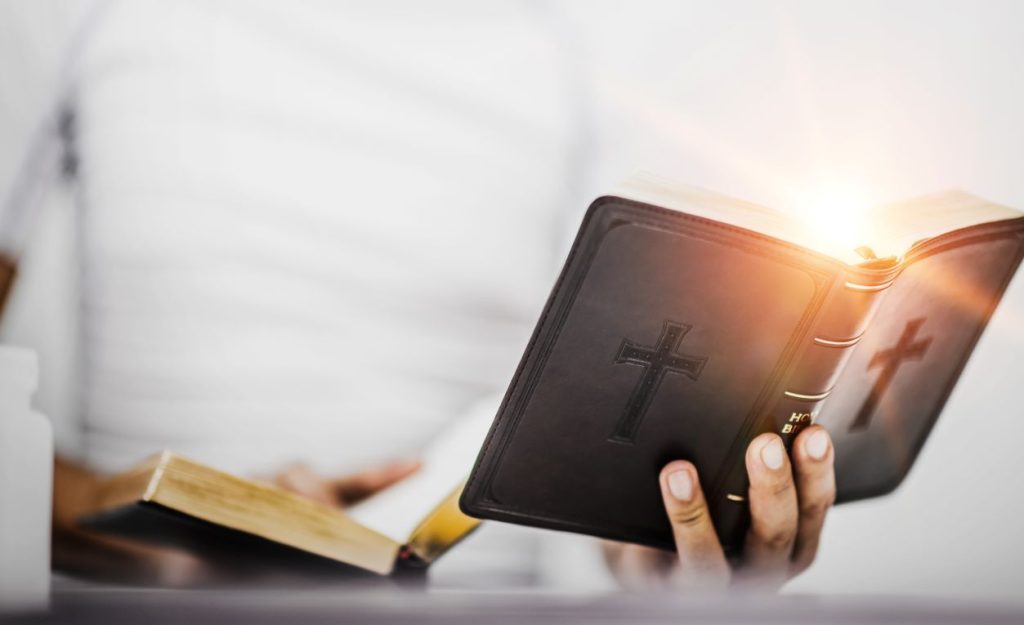 close-up-hand-holding-bible